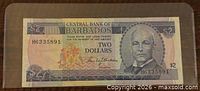 Obverse of 1973 Barbados $2 note showing portrait and serial number