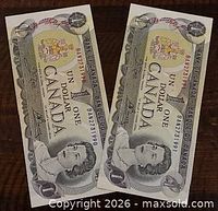 Front view of both 1973 $1 banknotes showing serial numbers and Queen portrait