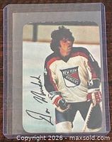 Front of Don Murdoch glossy hockey card in sleeve