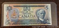 Obverse of Canadian $5 note in sleeve