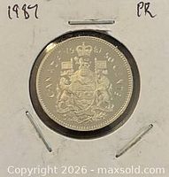 Reverse of 1987 Canada 50-cent proof coin showing coat of arms