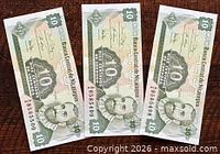 Front view of three consecutive 10 centavos banknotes