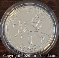 Reverse showing petroglyph design and CANADA inscription