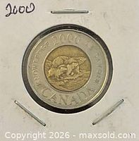 Reverse side of 2000 Canadian $2 Path of Knowledge coin in holder