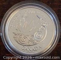 Reverse of silver proof 25-cent Millennium "Achievement" coin in capsule