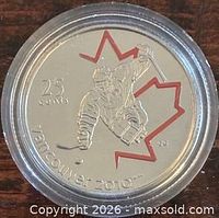 Reverse of 2009 colour Sledge Hockey 25-cent coin in holder