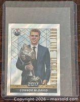 Front of sticker showing Connor McDavid with Hart Trophy, card number and design visible