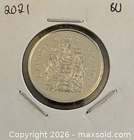 Reverse showing Canadian coat of arms