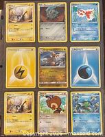 Nine Pokémon cards displayed front-side in binder sleeve