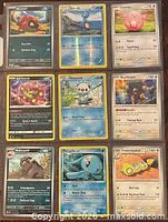 Front view of nine Pokémon cards in binder sleeve