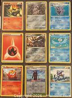 Front view of nine Pokémon cards in 3×3 binder page