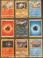 Front view of all nine Pokémon cards arranged in 3x3 grid