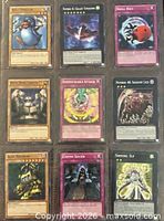 Front view of nine Yu-Gi-Oh! cards in sleeves