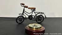 Metal bicycle model and barometer group shot