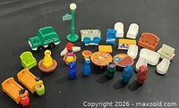 All 31 Fisher-Price Sesame Street pieces laid out