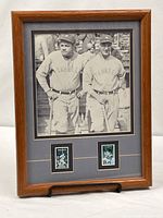 Full view of framed display showing photo and stamps