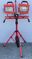 Full view of Craftsman dual halogen work light on red tripod stand, cord visible