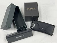 Group view of Ray-Ban case and Bulova boxes