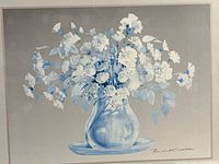 close view of floral print showing blue and white chrysanthemums in vase