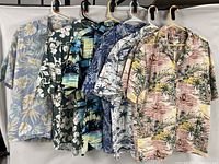 Front view of all six shirts hanging side by side