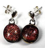 Front view of both earrings showing red-gold dichroic glass and sterling posts