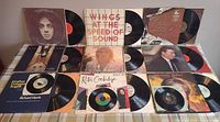 overview of all LPs and 45s laid out with jackets and vinyl partially visible