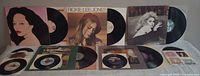 Overview showing three upright LPs (Diana Ross, Rickie Lee Jones, Olivia Newton-John), two horizontal LP jackets (Luba, Sheena Easton) and six 45s