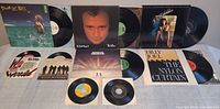 All records laid out to show fronts of LP jackets and 45 sleeves