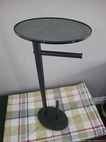Full view of stand showing arm, spare roll post and shelf