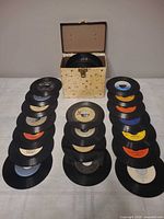 Overall view of carrying box and three stacks of 7-inch singles