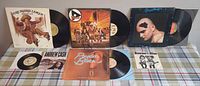 Group shot of all LP albums and 7" singles laid out on table