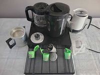 Overall view of all appliances, pod holder, reusable pods and accessories