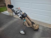 Full view of bag on pull cart with clubs inside