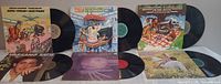 All six LPs displayed with records partially out of sleeves