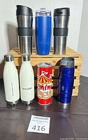 Group shot of all seven insulated bottles on crate