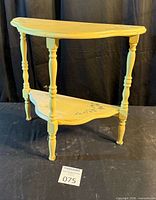 Front view of two-tier half-moon table