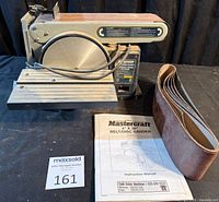 Overall view of sander, manual and sanding belts