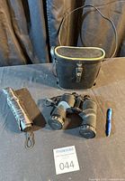 Binoculars, case, umbrella, reference pen