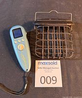 Feeder and identifier side by side with auction tag