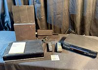 Overview showing Sony main unit, speakers, Panasonic VCR, both remotes