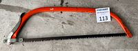 Full view of orange 24" bow saw with blade and MaxSold tag 113