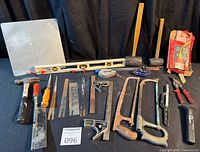 Group shot of all tools on table against black backdrop