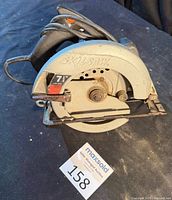 Left side view of Skil 7-1/4 in. circular saw showing blade guard and overall condition