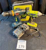 Overall view of drill, driver, batteries, chargers and carry bag