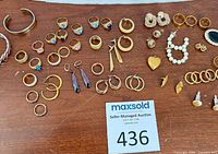 Overview of entire jewelry lot on table