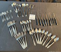 Full lot layout of forks, spoons and steak knives