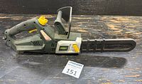 Left side view of Yardworks electric chainsaw showing full body, handle, bar, chain and guard
