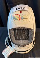 Front and side view of Noma HC-0117 heater showing entire unit
