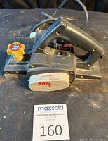 Overall view of Skil hand planer showing handle, cord and base