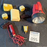 Group shot showing all adapters, testers and flashlight